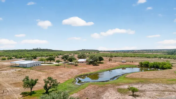 an aerial view of a houses with outdoor space