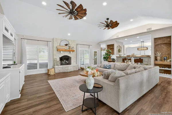 a living room with furniture and a fireplace