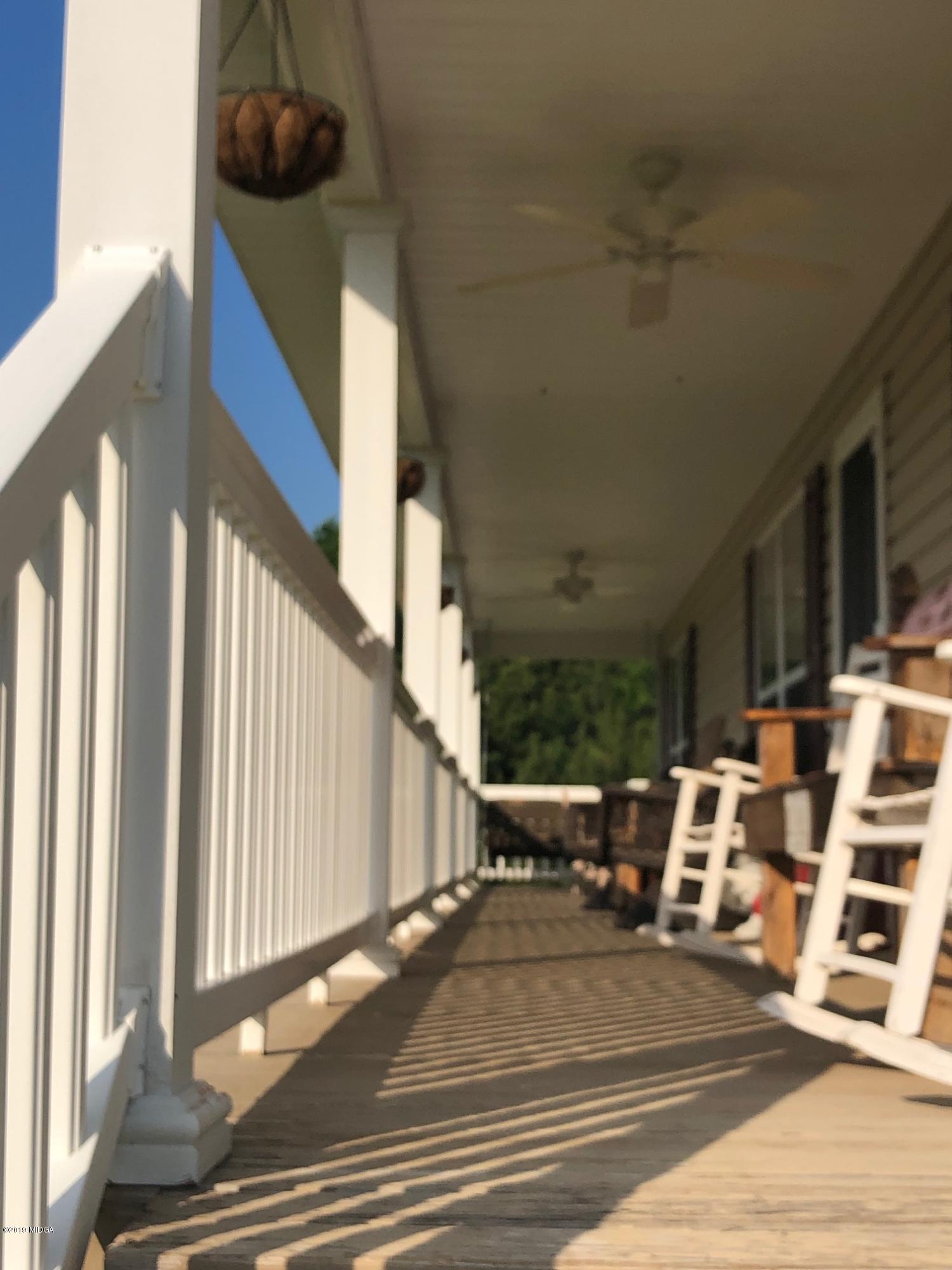 445 Childs Road Roberta, GA 31078 - Photo 16 of 23 a view of a patio with table and chairs