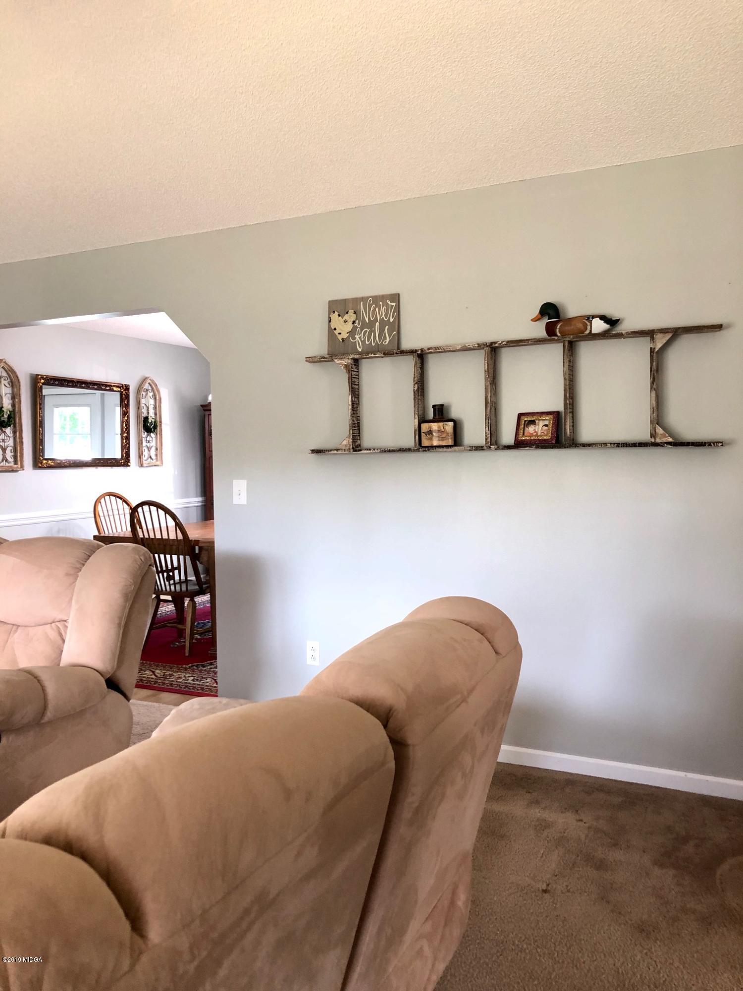 445 Childs Road Roberta, GA 31078 - Photo 6 of 23 a bedroom with furniture and lamp