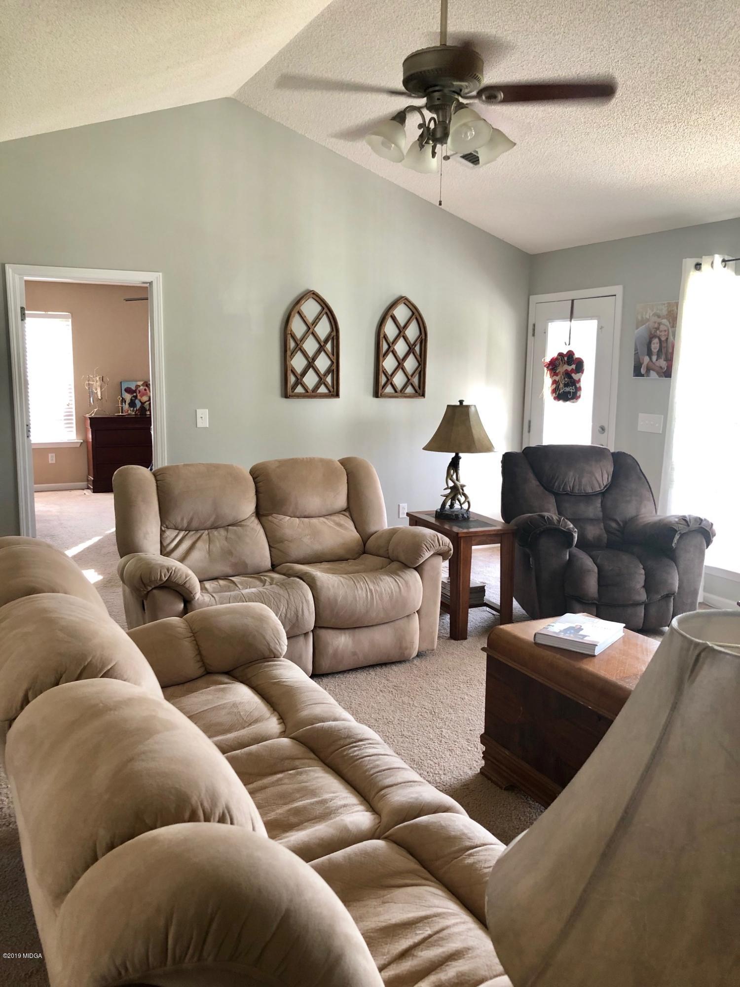 445 Childs Road Roberta, GA 31078 - Photo 8 of 23 a living room with furniture and a ceiling fan
