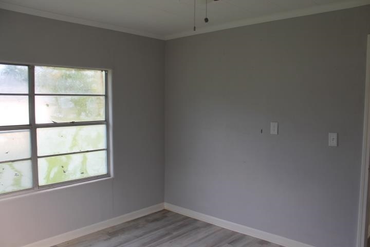 875 Woodrow Street Silsbee, TX 77656 - Photo 25 of 30 an empty room with a window
