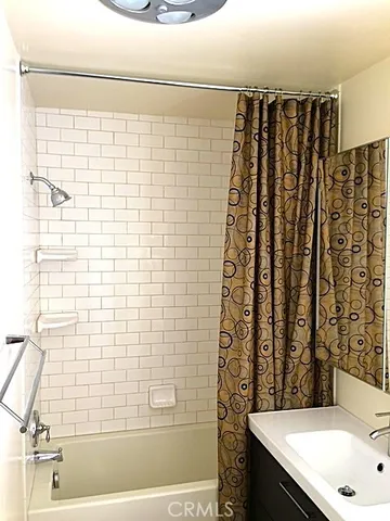 a bathroom with a sink and a shower