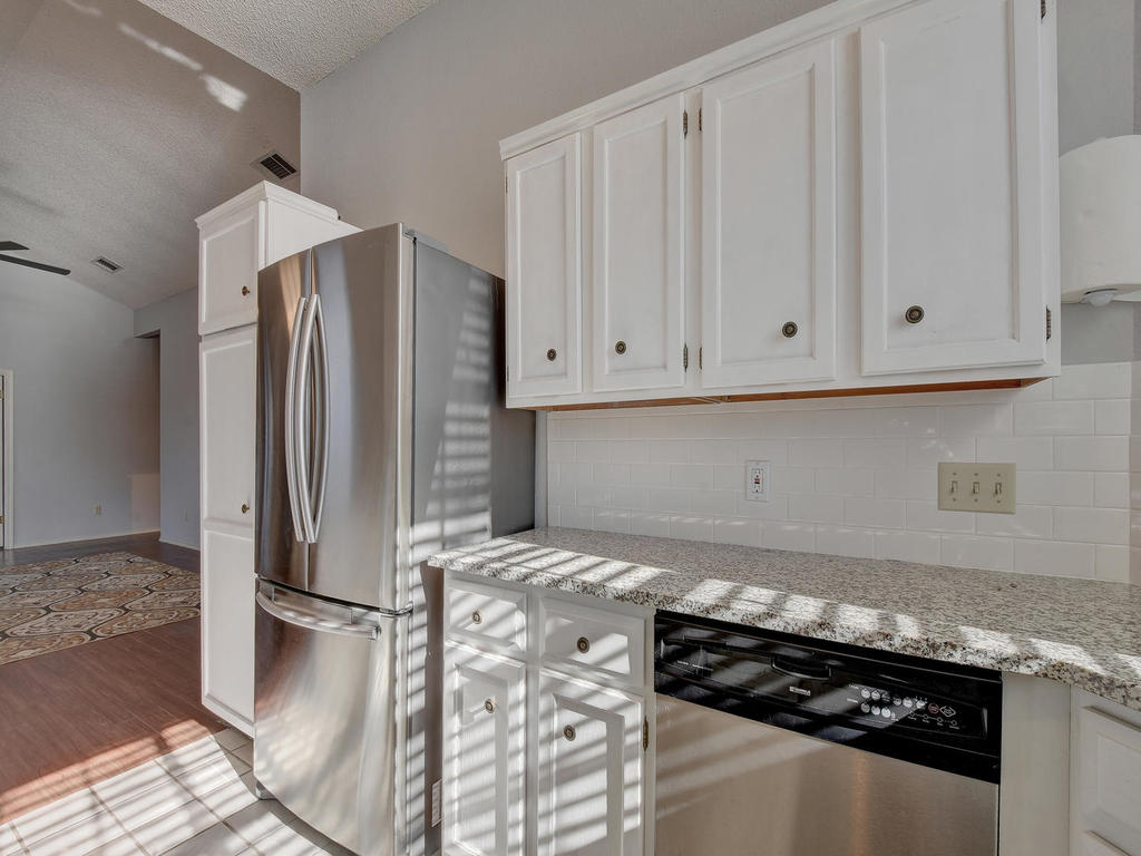 3019 Rochelle Drive Austin, TX 78748 - Photo 11 of 21 a kitchen with stainless steel appliances granite countertop a refrigerator and a stove
