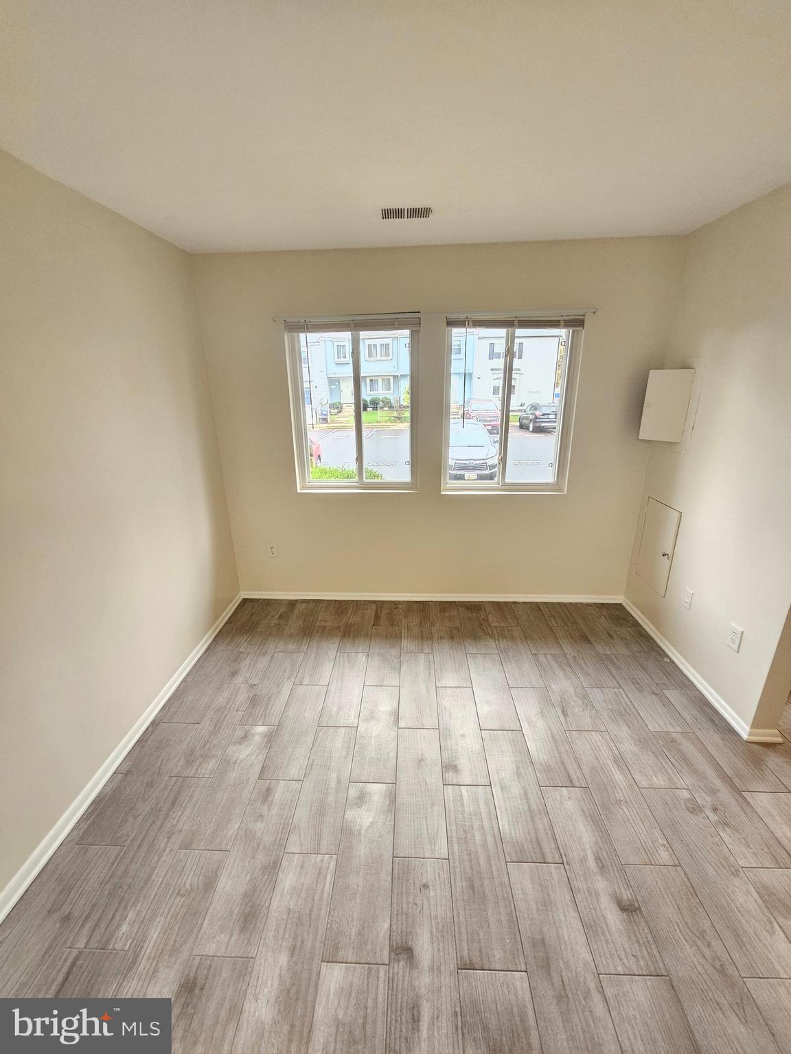 17445 Hoskinson Road Poolesville, MD 20837 - Photo 5 of 37 an empty room with wooden floor and windows
