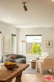 a living room with a couch and a large window