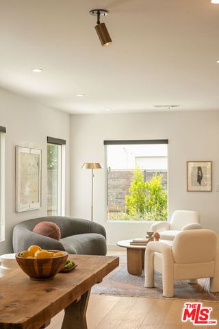 a living room with a couch and a large window