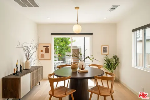 a view of a dining room with furniture window and outside view