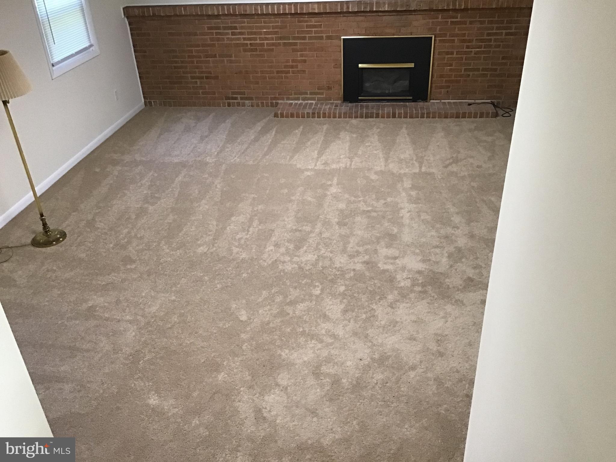 13015 Hathaway Drive Silver Spring, MD 20906 - Photo 10 of 41 brick gas fireplace, new carpet family room