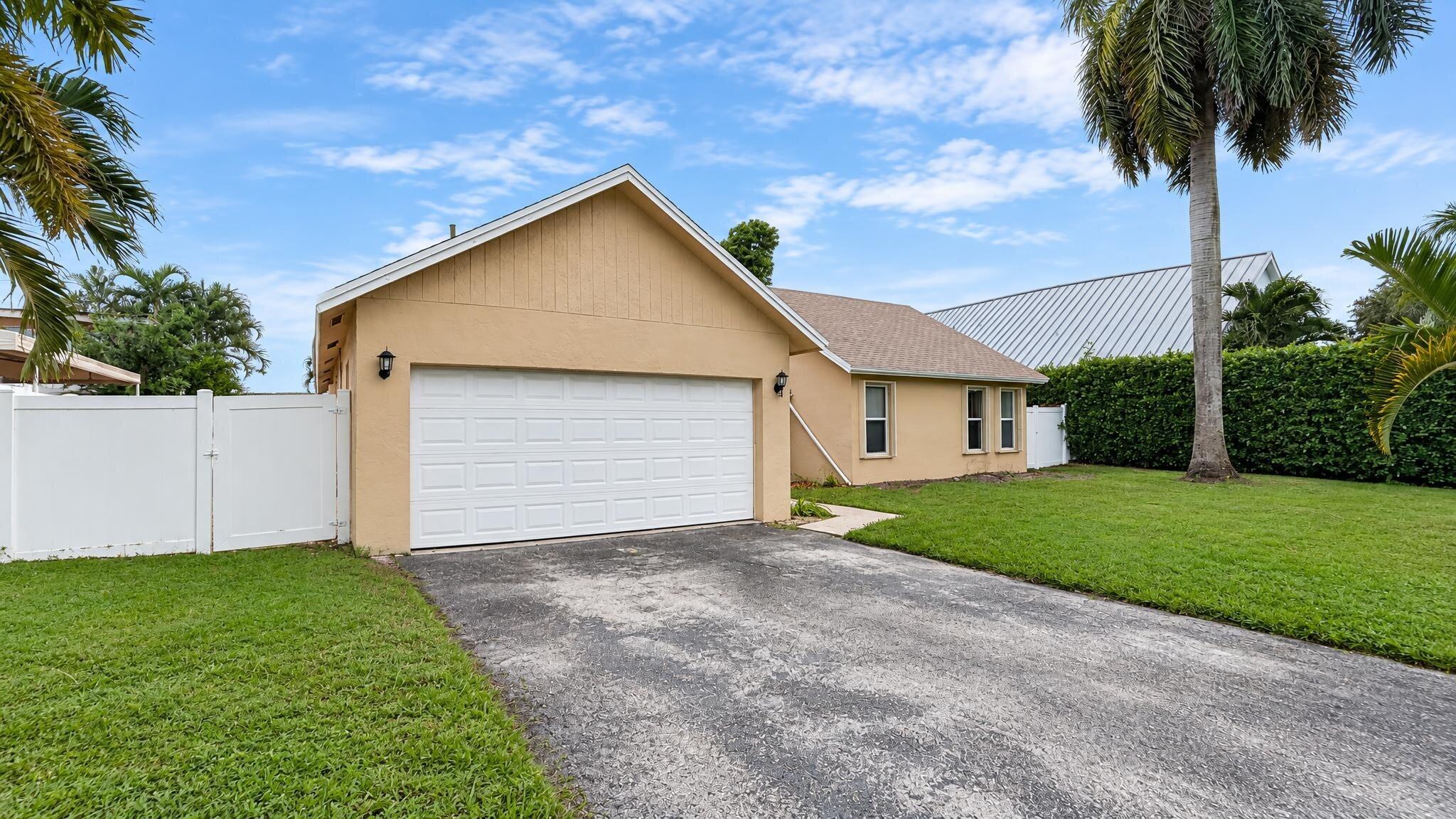 118 Mohigan Circle Boca Raton, FL 33487 - Photo 1 of 27 01_118_Mohigan_Cir_Exterior_Front_16x9