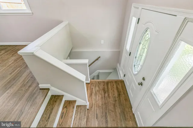a view of stairs and with wooden floor