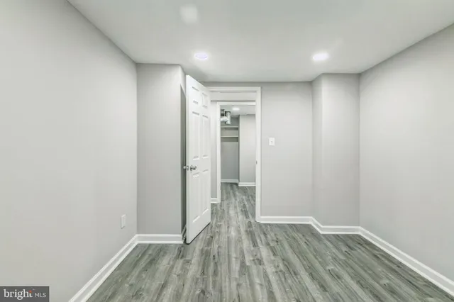 a view of hallway with wooden floor