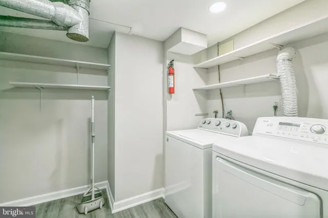 a view of storage and utility room with washer and dryer