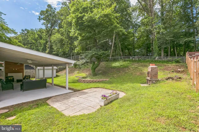 a view of a house with a yard porch and sitting area