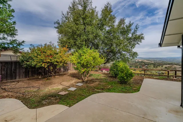 a house view with a garden space