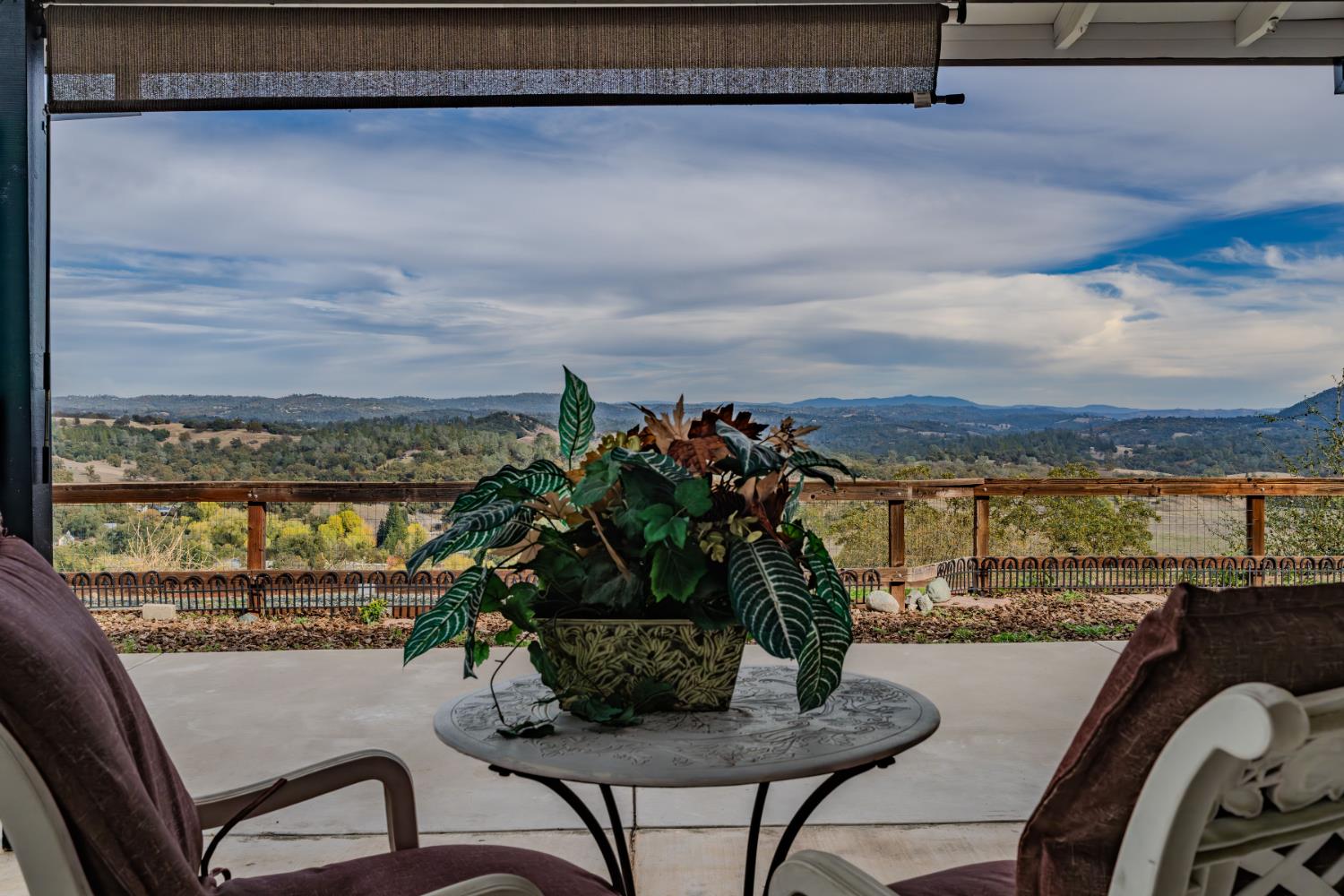 10370 Spunn Road Jackson, CA 95642 - Photo 21 of 87 a view of a balcony with furniture and a floor to ceiling window
