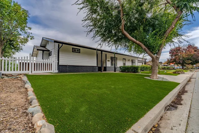 a kitchen with stainless steel appliances a refrigerator a stove a sink cabinets and a counter space