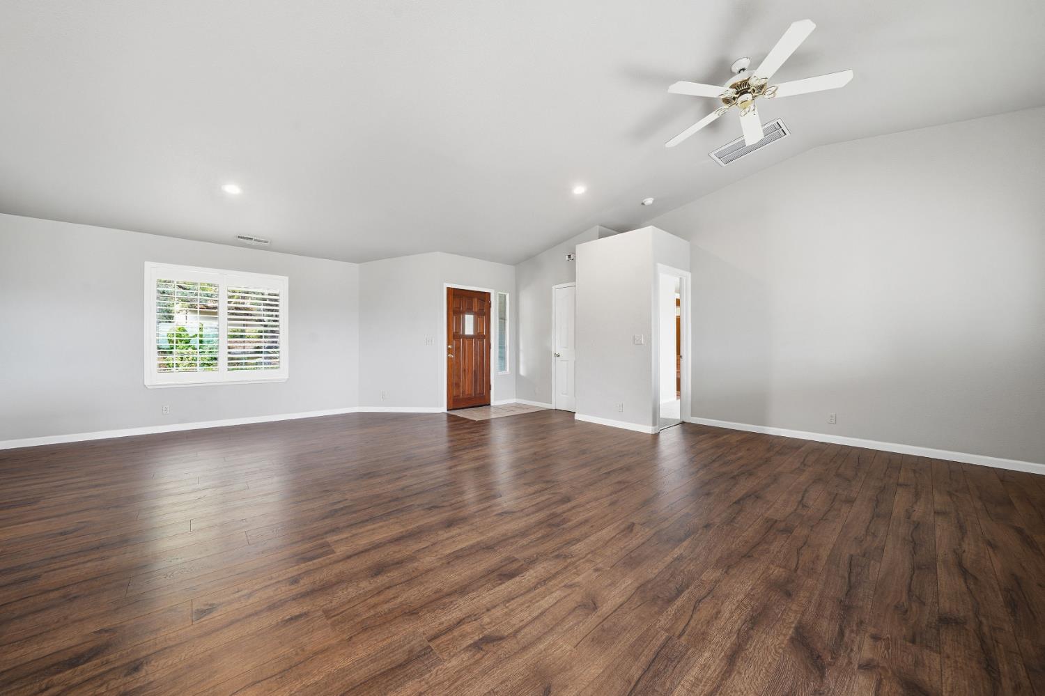 10370 Spunn Road Jackson, CA 95642 - Photo 39 of 87 a view of an empty room with a window and wooden floor