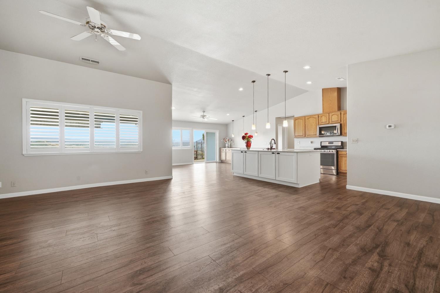 10370 Spunn Road Jackson, CA 95642 - Photo 43 of 87 a view of a kitchen with a kitchen island wooden floor and a window
