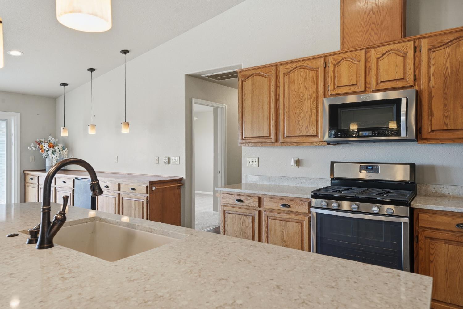 10370 Spunn Road Jackson, CA 95642 - Photo 46 of 87 a kitchen with stainless steel appliances granite countertop a stove a sink and a microwave