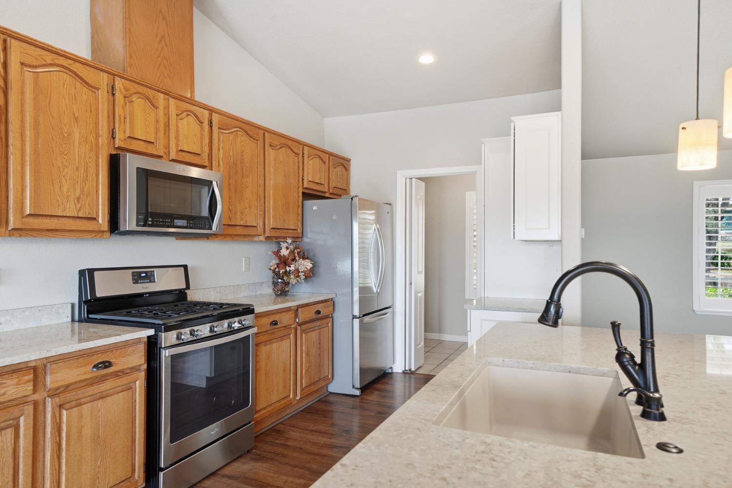 10370 Spunn Road Jackson, CA 95642 - Photo 50 of 87 a kitchen with stainless steel appliances granite countertop a stove a sink and a microwave