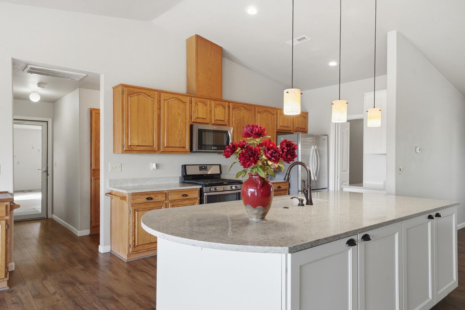 10370 Spunn Road Jackson, CA 95642 - Photo 51 of 87 a kitchen with stainless steel appliances granite countertop a sink cabinets and wooden floor