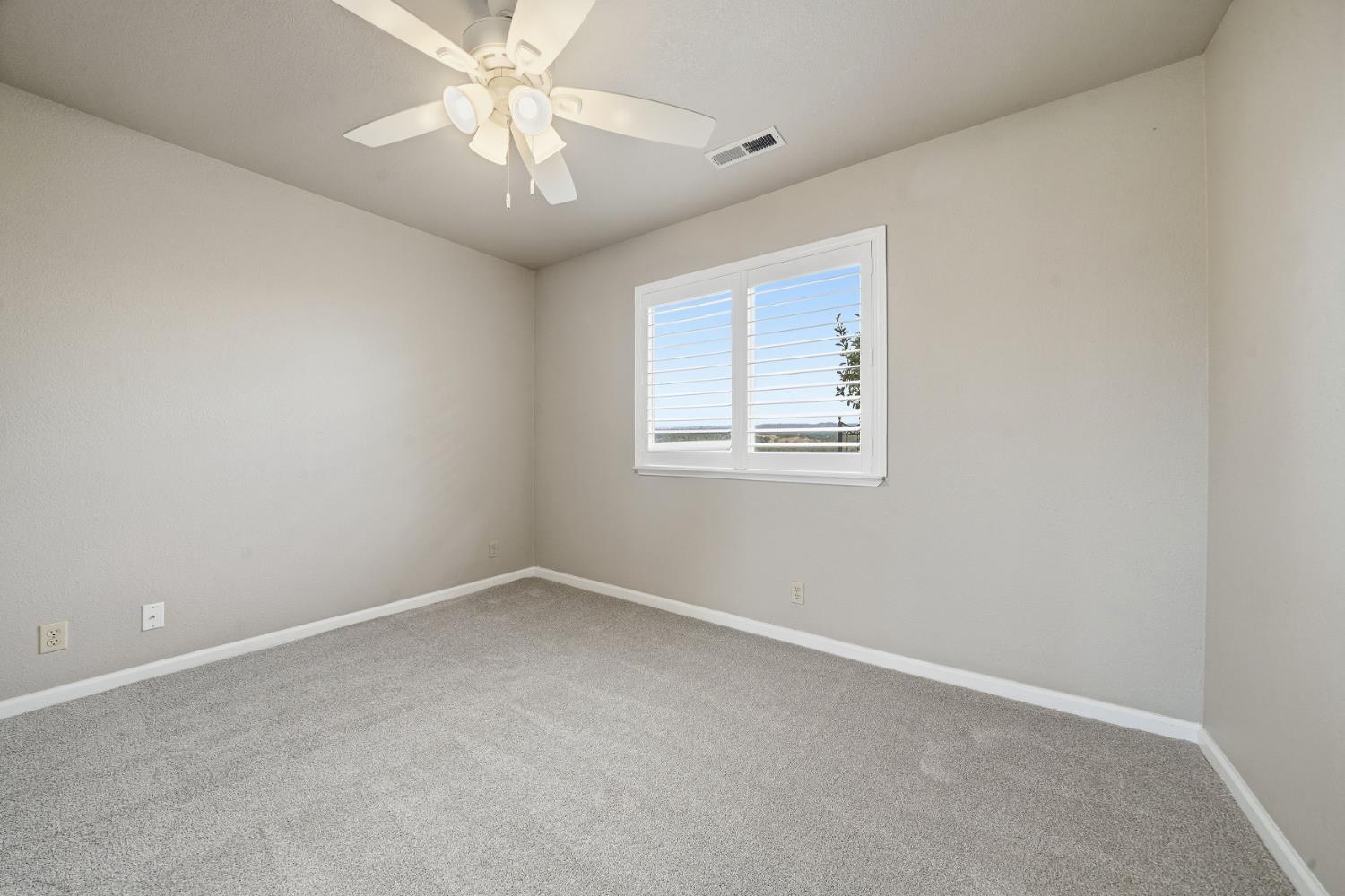 10370 Spunn Road Jackson, CA 95642 - Photo 69 of 87 an empty room with a window and a fan