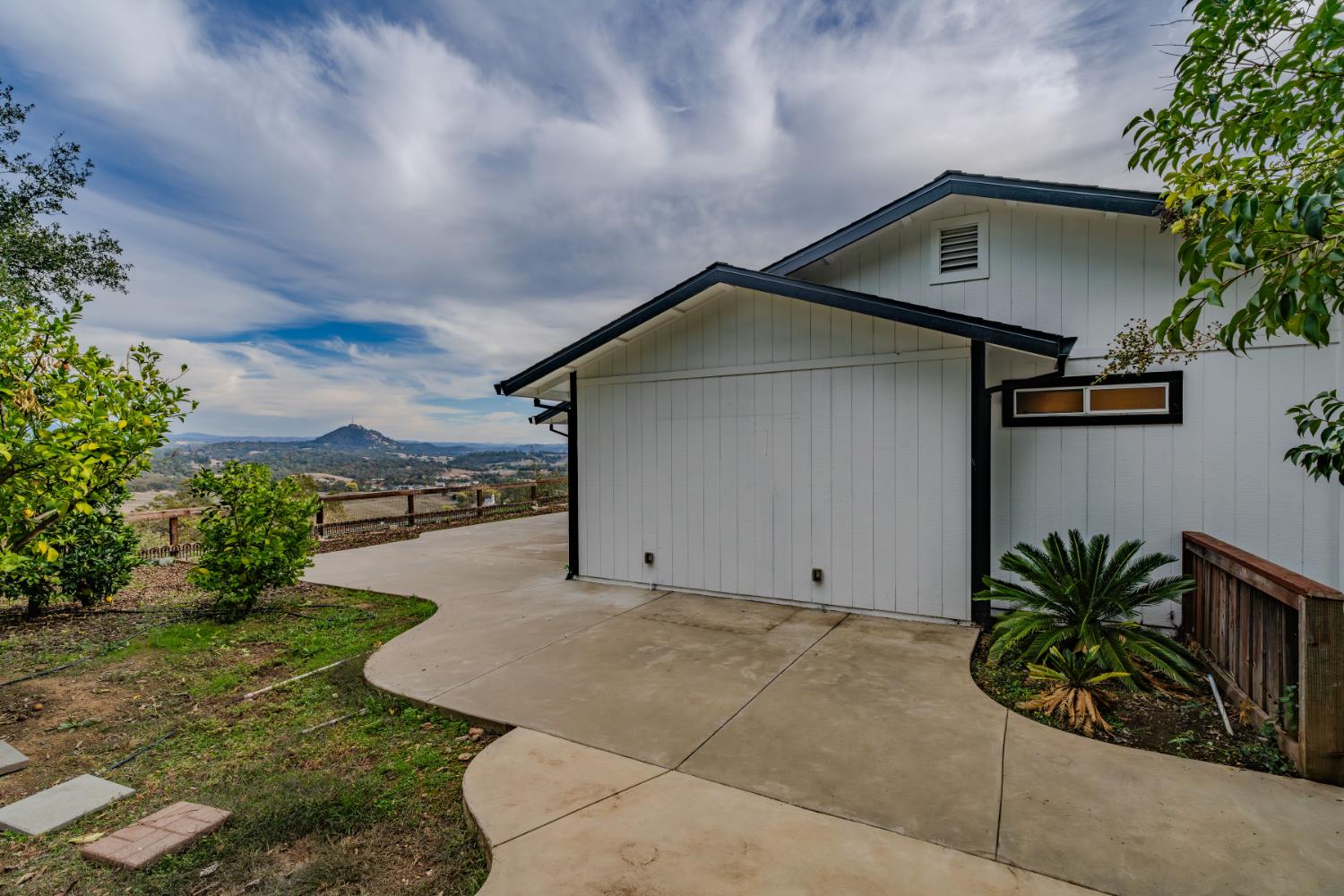 10370 Spunn Road Jackson, CA 95642 - Photo 8 of 87 a house with a yard and potted plants