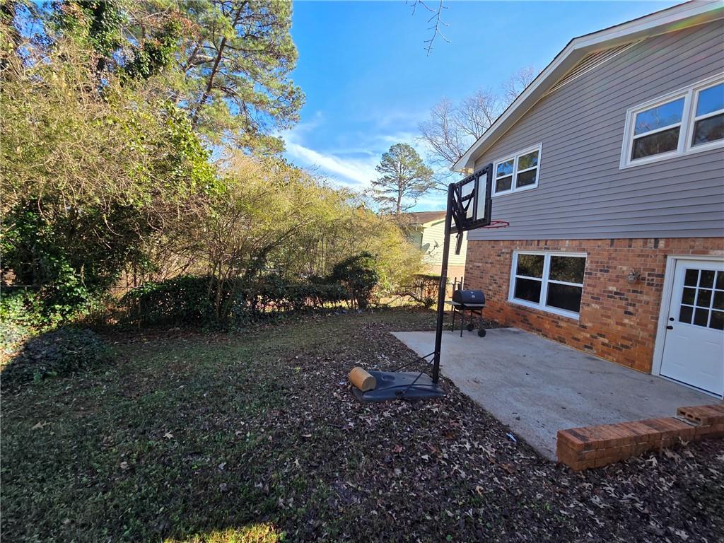 4330 Dogwood Farm Road Lithonia, GA 30038 - Photo 4 of 11 a backyard of a house with lots of green space