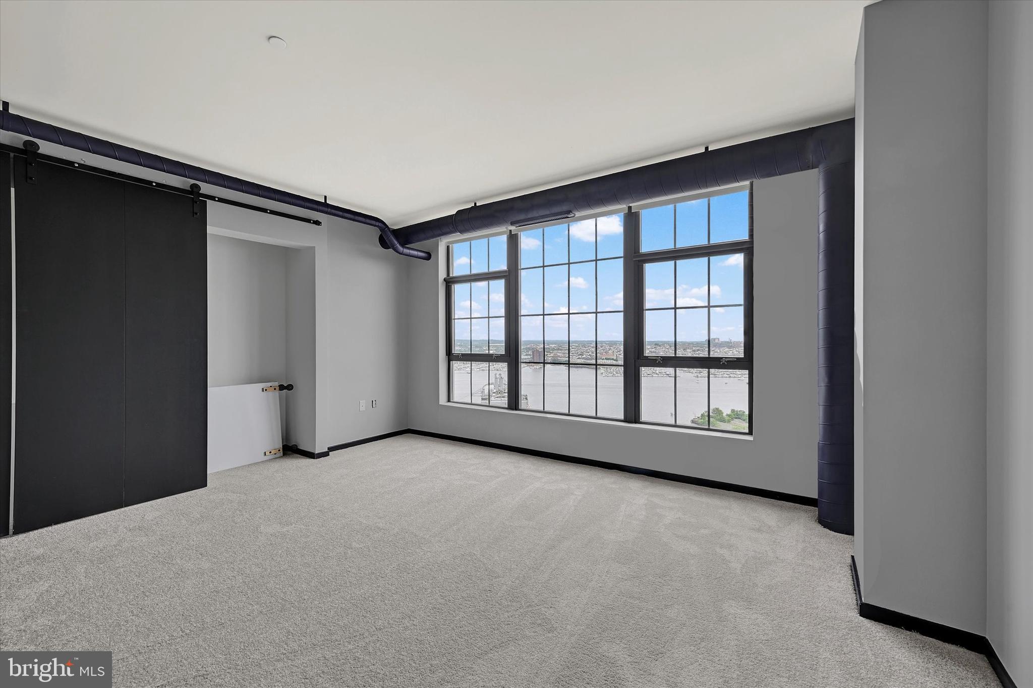 1200 Steuart Street, Unit 1913 Baltimore, MD 21230 - Photo 56 of 94 Guest suite with harbor views.
