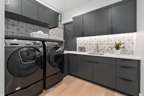a utility room with cabinets