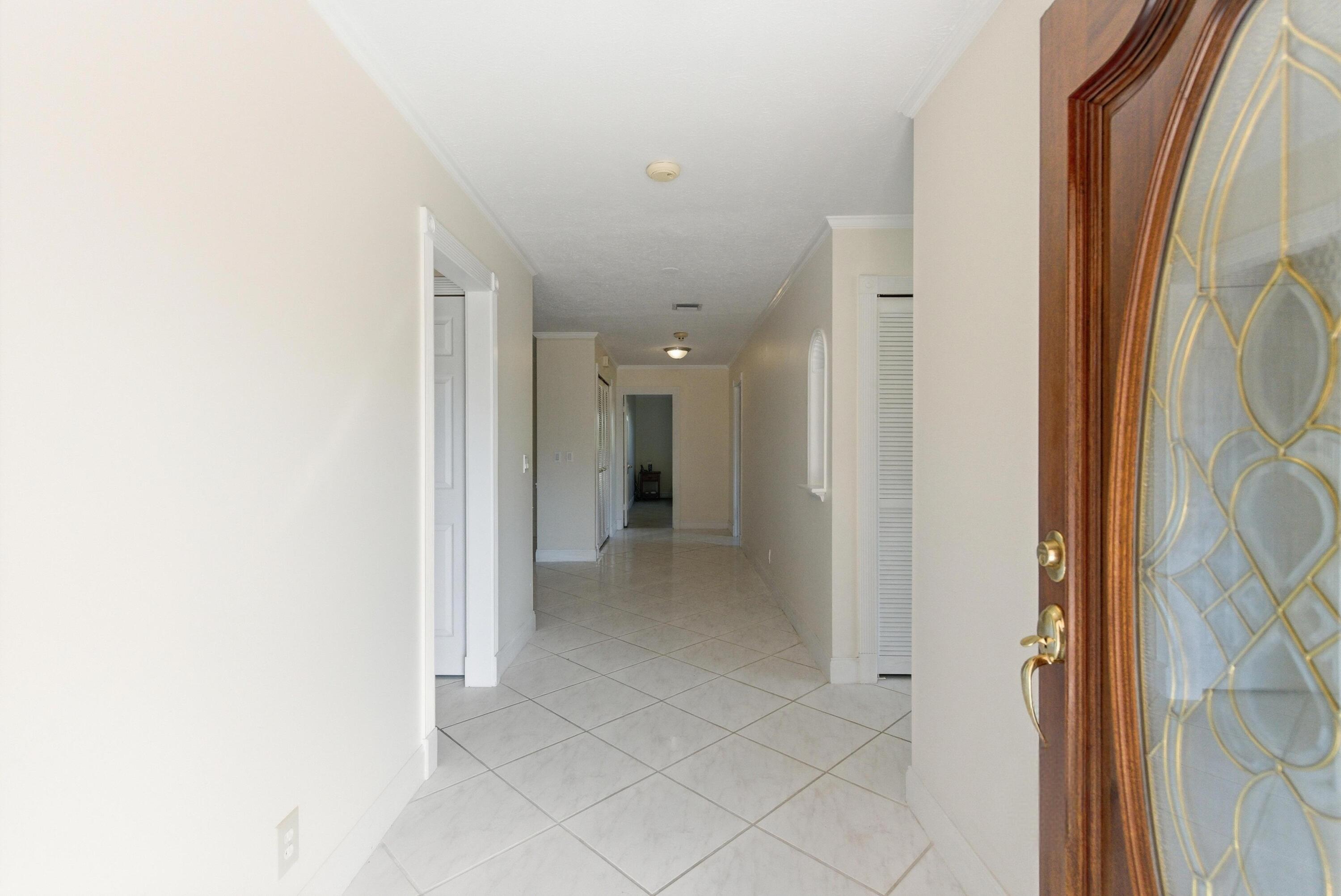 5151 Southeast Burning Tree Circle Stuart, FL 34997 - Photo 6 of 74 a view of a hallway