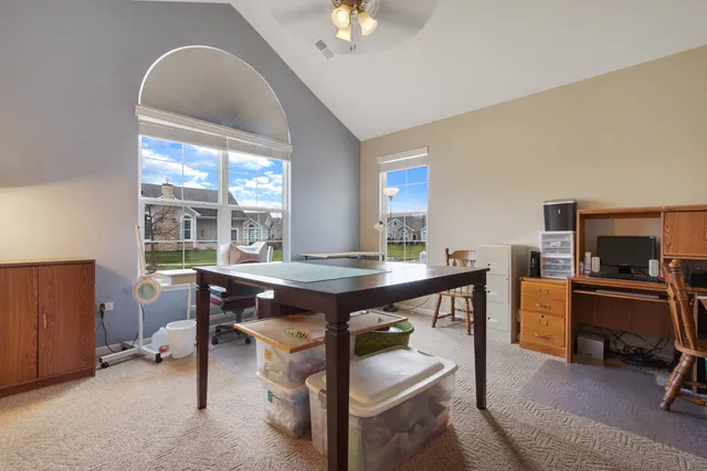 a view of a workspace with furniture