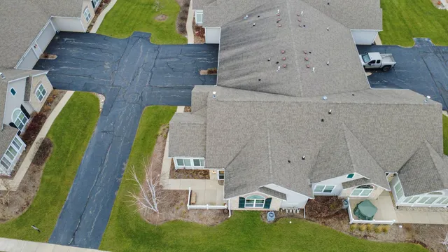 an aerial view of residential house with outdoor space and swimming pool