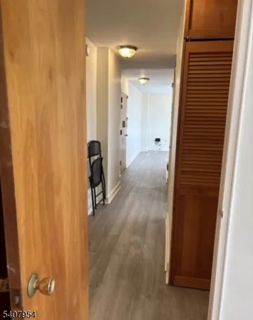 a view of hallway with walk in closet