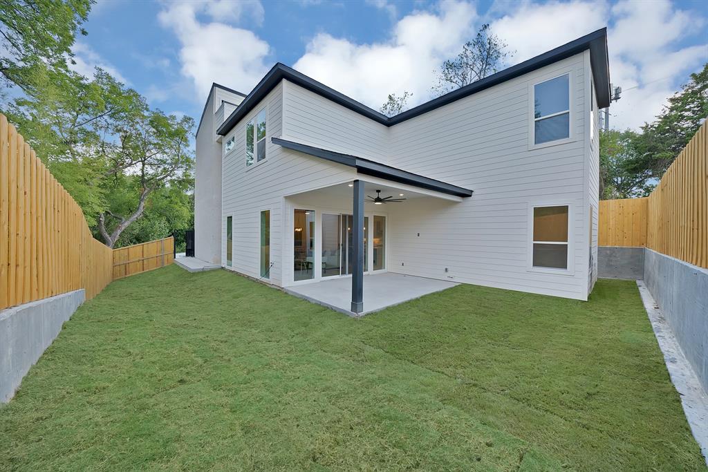 1415 Fayette Street Dallas, TX 75203 - Photo 39 of 40 Modern exterior with white siding, black trim, and multiple windows