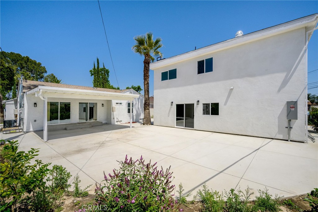 8435 Rincon Avenue Sun Valley, CA 91352 - Photo 20 of 61 a front view of a house with a yard and garage