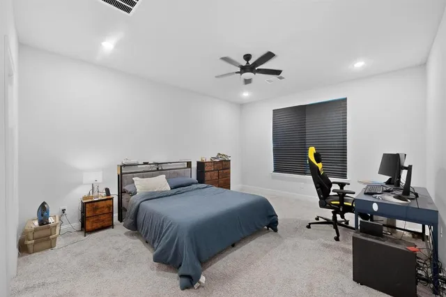 a bedroom with furniture and a window