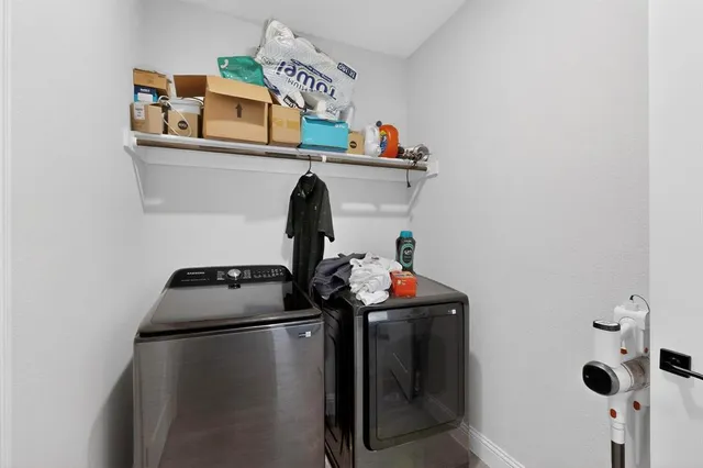 a kitchen with a refrigerator and a stove