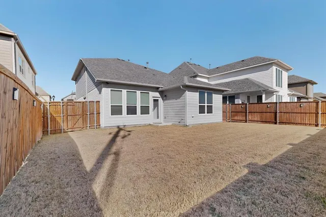 a house view with a backyard space