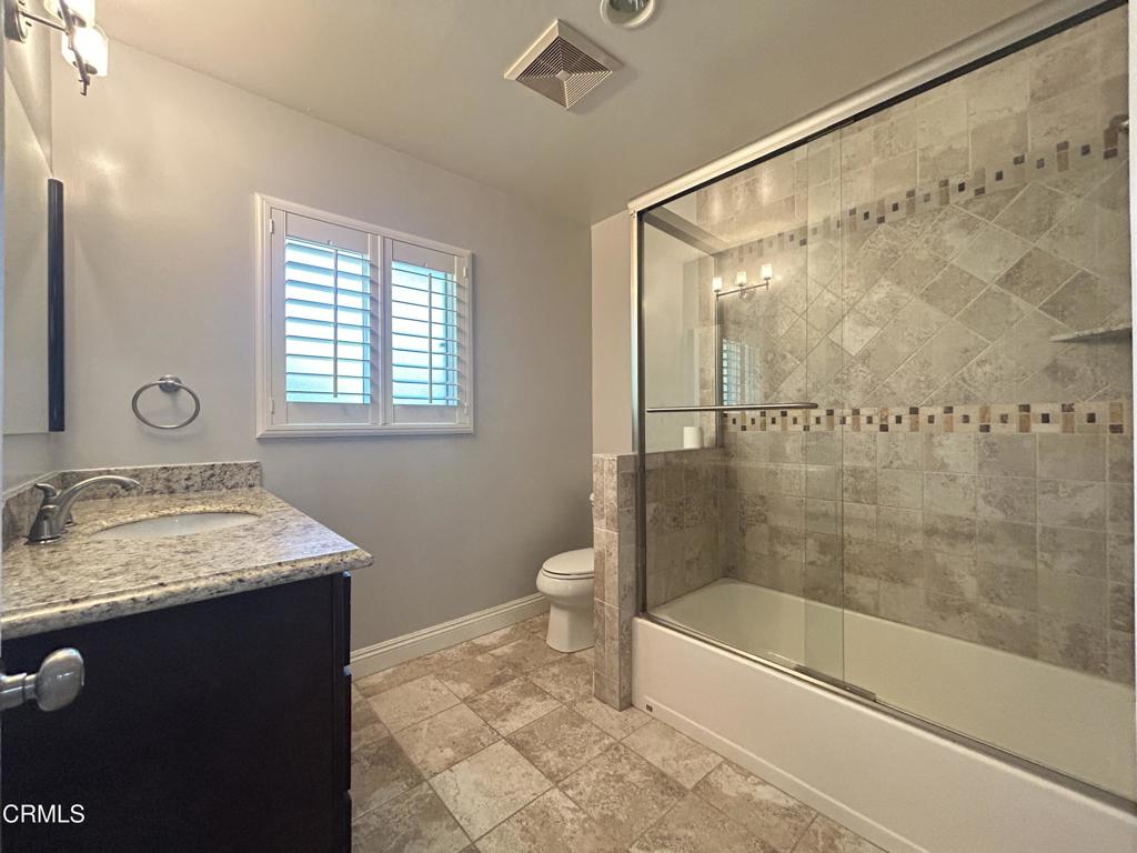 5026 Hook Tree Road La Canada Flintridge, CA 91011 - Photo 12 of 25 a bathroom with a granite countertop sink a toilet and shower