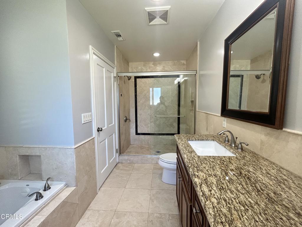 5026 Hook Tree Road La Canada Flintridge, CA 91011 - Photo 14 of 25 a bathroom with a granite countertop tub sink and mirror