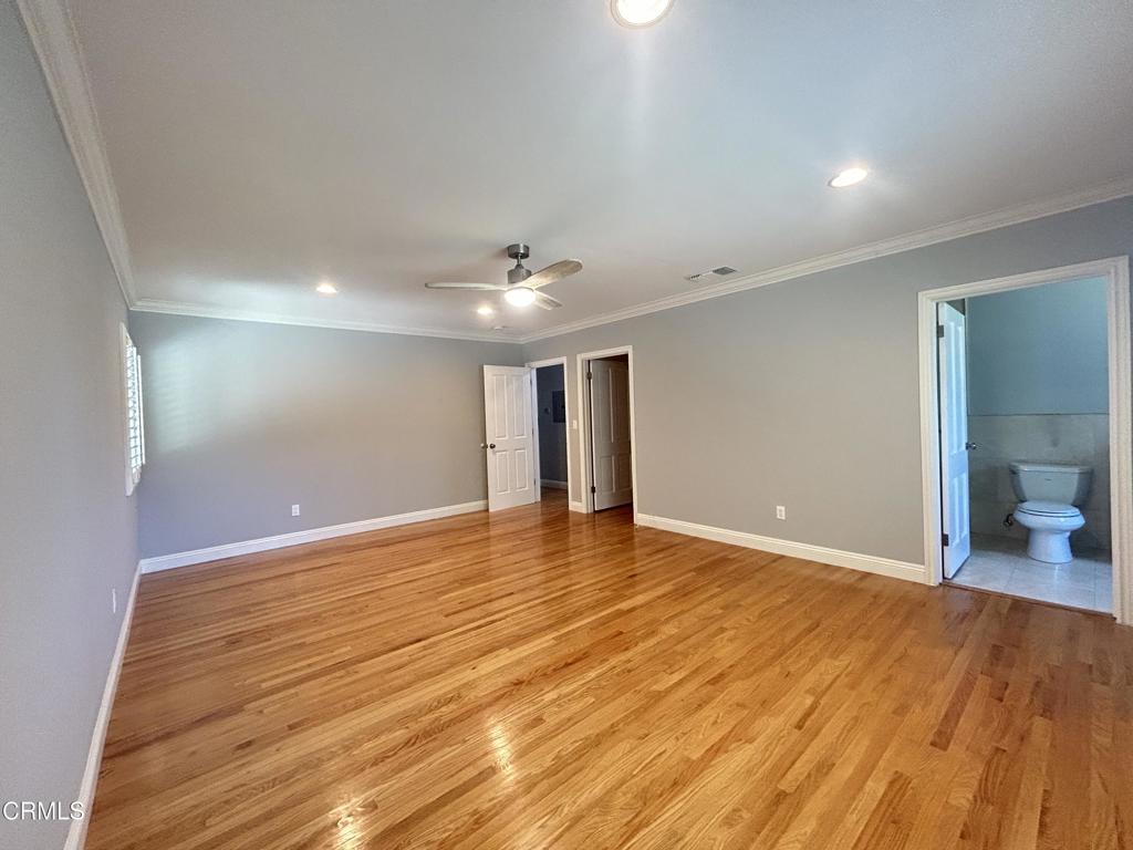 5026 Hook Tree Road La Canada Flintridge, CA 91011 - Photo 16 of 25 a view of an empty room with wooden floor and a bathroom