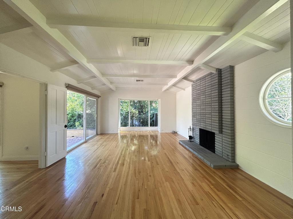 5026 Hook Tree Road La Canada Flintridge, CA 91011 - Photo 3 of 25 a view of an empty room with wooden floor and a window