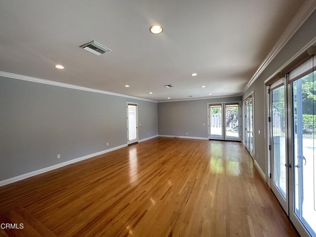 5026 Hook Tree Road La Canada Flintridge, CA 91011 - Photo 8 of 25 a view of an empty room with wooden floor and a window