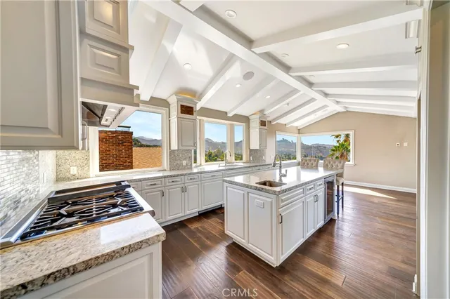 a view of an entryway with wooden floor and windows