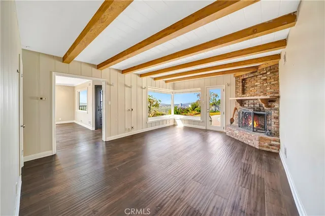 a bathroom with a granite countertop sink a toilet and a mirror