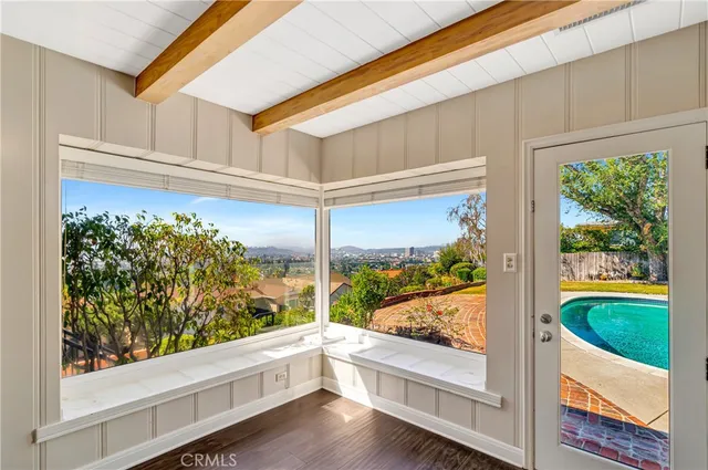 a bathroom with a granite countertop sink mirror and shower
