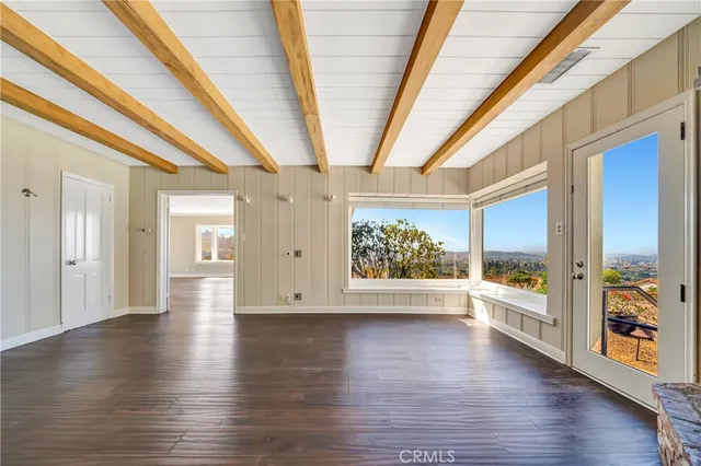 a bathroom with a granite countertop sink a mirror a shower and a bathtub