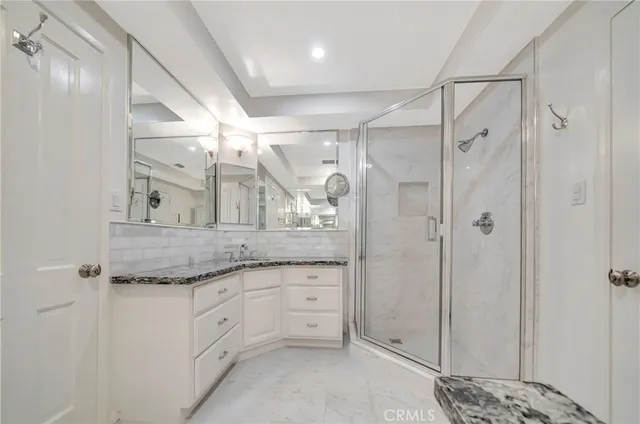 a spacious bedroom with a bed and a couch